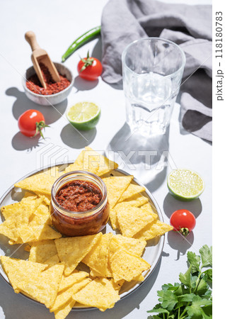 Salsa and nachos sauce is a traditional Mexican snack with tomatoes and hot peppers  118180783