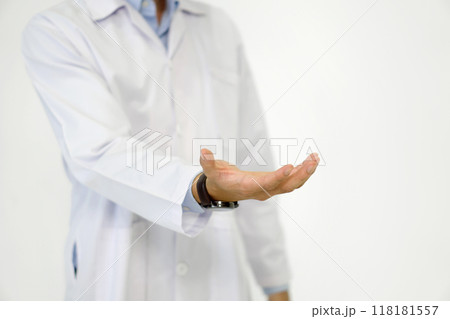Doctor or scientist in a white lab coat standing with his hand open and facing up, suggesting a gesture of offering, explaining, or questioning. Portrait on white background, studio shot. Doctor or scientist in a white lab coat standing with his hand open and facing up, suggesting a gesture of offering, explaining, or questioning. Portrait on white background, studio shot. 118181557