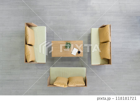 High angle view of modern coworking space. Coffee cup, flower pot and spiral notebook are on wooden table. 118181721