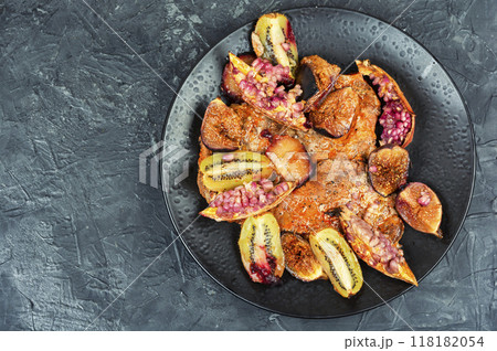 Meat tenderloin baked with fruits. Meat tenderloin baked with fruits. 118182054