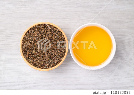 Perilla seeds and oil (Cold pressed) in bowl on white table, Food ingredient, Top view 118183052