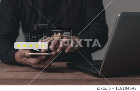 Satisfaction Review, Young Man with laptop hand touching smartphone five star Satisfaction Review, Young Man with laptop hand touching smartphone five star 118184648