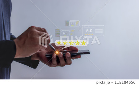 Satisfaction Review, Young Man using smartphone mobile hand with pen touching five star 118184650