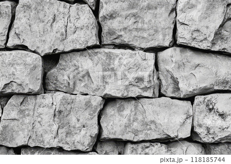 Rough stone wall. Rugged texture of the stacked blocks 118185744