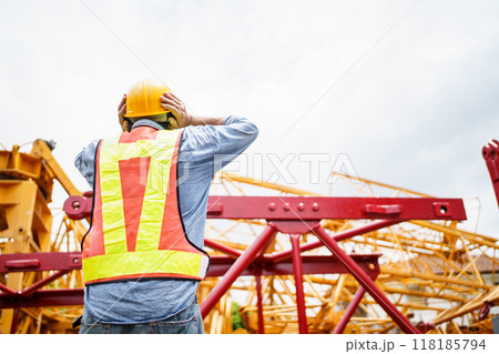 Engineer is looking at the collapse construction. Engineer is looking at the collapse construction. 118185794