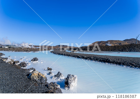 Blue Lagoon in Iceland: A Tranquil Geothermal Spa Amidst Black Lava Rocks. 118186387