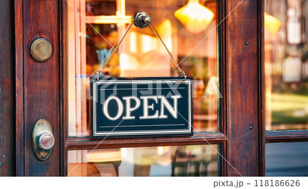 Open sign hanging in front door on restaurant or coffee at entrance. 118186626