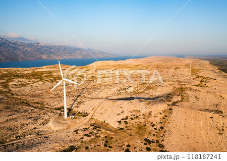 Wind turbines produce sustainable electric power on Pag Island. Innovative solution to obtain sustainable source of electricity without harm in Croatia 118187241