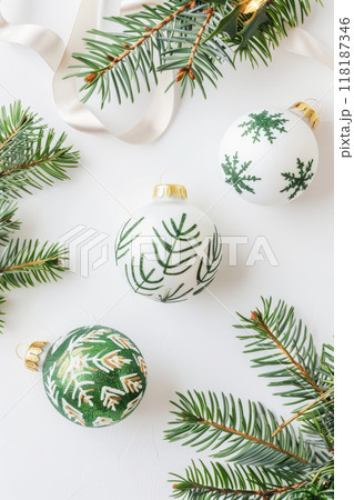 Elegant Christmas Ornaments with Greenery on White Background. Minimalist Holiday Design 118187346