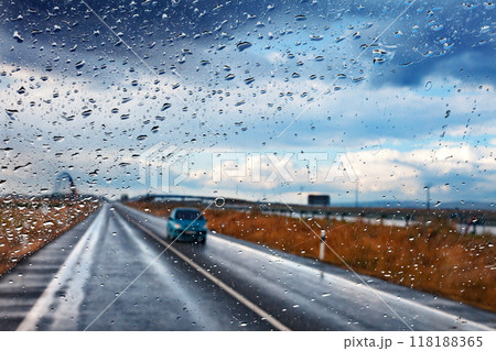 Car and road in stormy day.Safety drive concept. Car and road in stormy day.Safety drive concept. 118188365