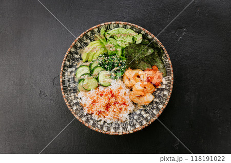 Shrimp poke bowl with rice, seaweed, avocado, and cucumber - fresh and healthy Asian-inspired dish 118191022
