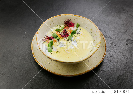 Creamy gourmet soup with shrimp, microgreens, and artistic presentation - elegant fine dining dish Creamy gourmet soup with shrimp, microgreens, and artistic presentation - elegant fine dining dish 118191076