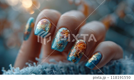 Hand with blue nails and gold floral design. Macro shot with bokeh lights for nail art design 118191550