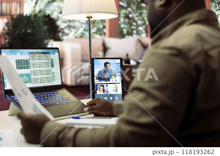 Business owner presenting the financial data reports to the investors members of the board, discussing on online videocall about expansion plans and new funding. Accounting analysis. 118193262