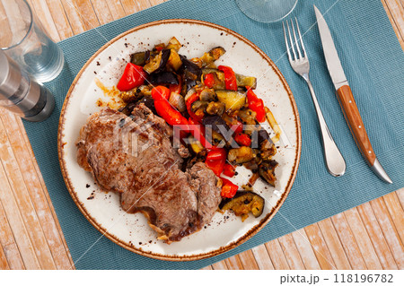 Beef steak with eggplant vegetable saute with bell pepper, onion and tomatoes Beef steak with eggplant vegetable saute with bell pepper, onion and tomatoes 118196782