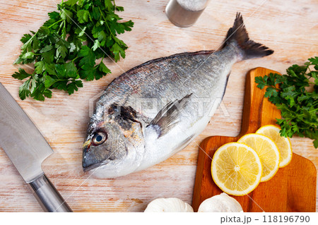 Whole dorado fish on wooden surface Whole dorado fish on wooden surface 118196790