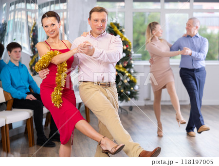 Incendiary paso doble dance during Christmas or New Year celebrations in dance studio Incendiary paso doble dance during Christmas or New Year celebrations in dance studio 118197005