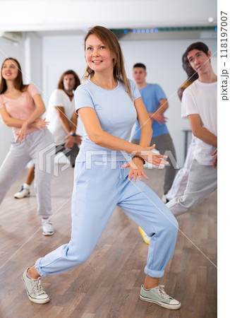 Group of different people rehearsing dance in dance studio Group of different people rehearsing dance in dance studio 118197007