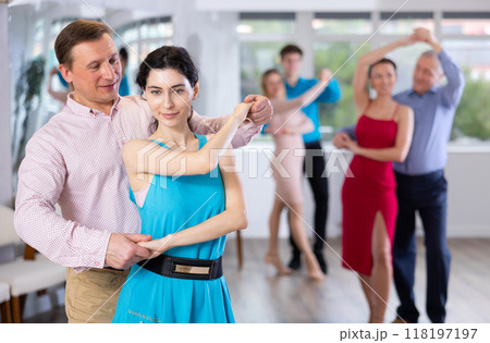 Man and woman dancing 118197197