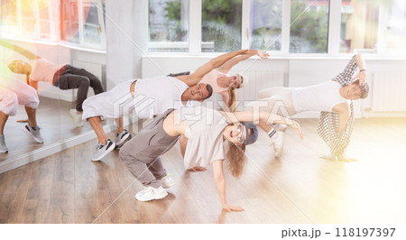 Young girl practicing breakdance in training hall 118197397