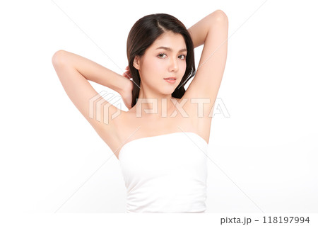 Beautiful Young Asian woman lifting hands up to show off clean and hygienic armpits or underarms on white background, Smooth armpit cleanliness and protection concept 118197994