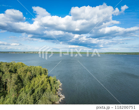 Aerial view of lake or river green shore with forest. Summer season. Aerial view of lake or river green shore with forest. Summer season. 118200751