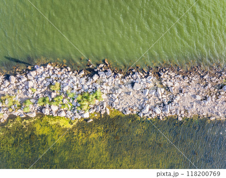 Aerial view of lake or river green shore with forest. Summer season. Aerial view of lake or river green shore with forest. Summer season. 118200769