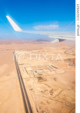View from the airplane window during takeoff in Sharm el-Sheikh, Egypt. View from the airplane window during takeoff in Sharm el-Sheikh, Egypt. 118200825