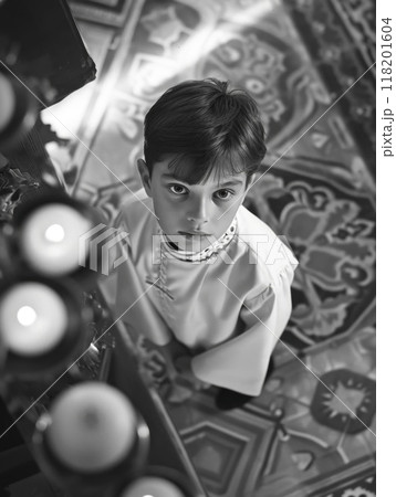 Sacred milestone - capturing the essence of first communion in a tender and symbolic portrayal, where young believers embrace the solemnity and spirituality of this significant rite Sacred milestone - capturing the essence of first communion in a tender and symbolic portrayal, where young believers embrace the solemnity and spirituality of this significant rite 118201604