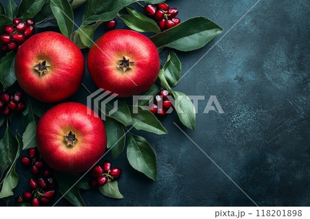 Apples and pomegranate seeds on dark background with copy space. Holiday card for the Jewish holiday of Rosh Hashanah 118201898