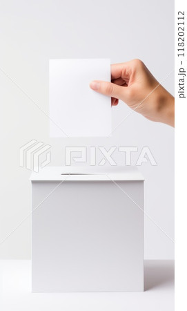 Civic duty - hand placing a ballot paper in ballot box for voting, emphasizing importance of election concept, showcasing anonymity of secret ballot, reflecting competitive nature of preelection race. 118202112