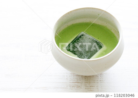 Cup of fresh matcha tea, green tea on white wooden table. Cup of fresh matcha tea, green tea on white wooden table. 118203046