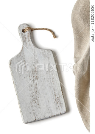 white wooden cutting board and linen kitchen tablecloth isolated on white background white wooden cutting board and linen kitchen tablecloth isolated on white background 118206656
