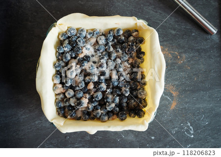 Cooking a blueberry, pie crust and filling with sugar and cinnamon before the oven 118206823
