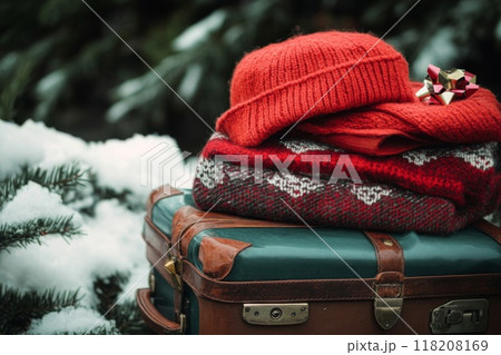 Red Knit Hat and Scarf Stacked on Vintage Suitcase Red Knit Hat and Scarf Stacked on Vintage Suitcase 118208169