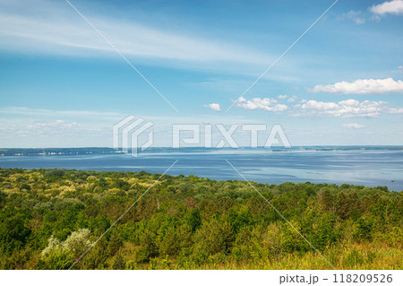 beautiful meadow on the hills with grass and flowers against the background of the sea and the sky beautiful meadow on the hills with grass and flowers against the background of the sea and the sky 118209526