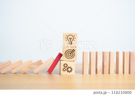 wood block falling to business icon with brainstorming, Target, goal, teamwork and strategy. risk management, Insurance and economic recession 118210800