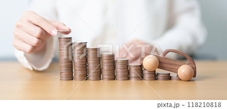 Money Saving, Car Insurance, Financial, vehicle Repair and Maintenance concepts. coins stack and piggy bank with Auto model, Money stack Counting arrangement for deposit and Automobile Tax Money Saving, Car Insurance, Financial, vehicle Repair and Maintenance concepts. coins stack and piggy bank with Auto model, Money stack Counting arrangement for deposit and Automobile Tax 118210818