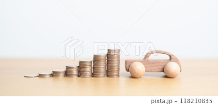 Money Saving, Car Insurance, Financial, vehicle Repair and Maintenance concepts. coins stack and piggy bank with Auto model, Money stack Counting arrangement for deposit and Automobile Tax 118210835