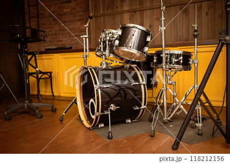 Drum set on stage in a recording studio. Musical instruments. Drum set on stage in a recording studio. Musical instruments. 118212156