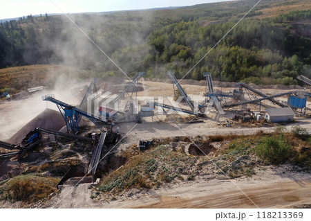 Aerial view of a stone quarry with working stone crushing machines Aerial view of a stone quarry with working stone crushing machines 118213369