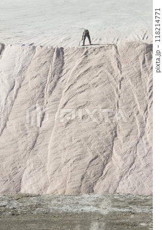 Worker unloading raw salt bulk, Salinas Grandes de Hidalgo, La Pampa, Patagonia, Argentina. Worker unloading raw salt bulk, Salinas Grandes de Hidalgo, La Pampa, Patagonia, Argentina. 118214771