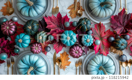 Thanksgiving decorations with teal pumpkins, magenta leaves, metallic gold accents. Top view image 118215942