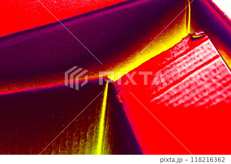 Empty open cardboard box, changed colors, bright background in pastel colors. 118216362