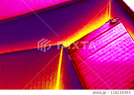 Empty open cardboard box, changed colors, bright background in pastel colors. 118216363