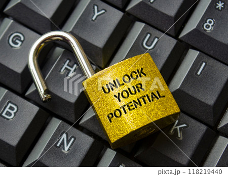 Unlock Your Potential text engraved on golden padlock with keyboard background. Motivational and Inspirational concept Unlock Your Potential text engraved on golden padlock with keyboard background. Motivational and Inspirational concept 118219440