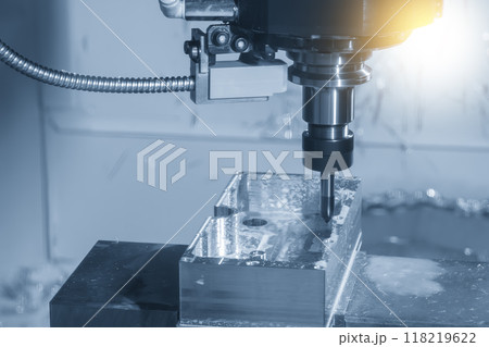The CNC milling machine chamfer cutting aluminum part by chamfer tool in the light blue scene. 118219622