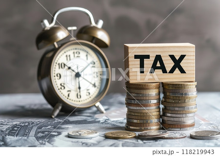 Tax season. Taxation. Word Tax on wooden blocks, calculator, coins stack, clock. Paperwork, financial research, report. Calculation tax. Personal banking. Finance. Planning budget. Calculating expense 118219943