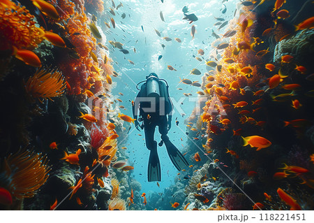 Professional diving, scuba diver in the depths of water with cylinders among colorful fish, corals and stones. 118221451