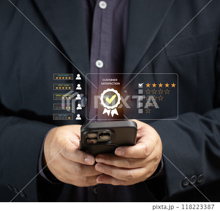Man rates satisfaction using smartphone via virtual screen. Concept of service satisfaction, survey, five star rating, highest satisfaction. Success business, quality service, survey feedback. Man rates satisfaction using smartphone via virtual screen. Concept of service satisfaction, survey, five star rating, highest satisfaction. Success business, quality service, survey feedback. 118223387